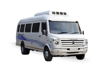 White 17-seater Tempo Traveller with tinted windows and rooftop air conditioning, ideal for group travel and outstation trips.